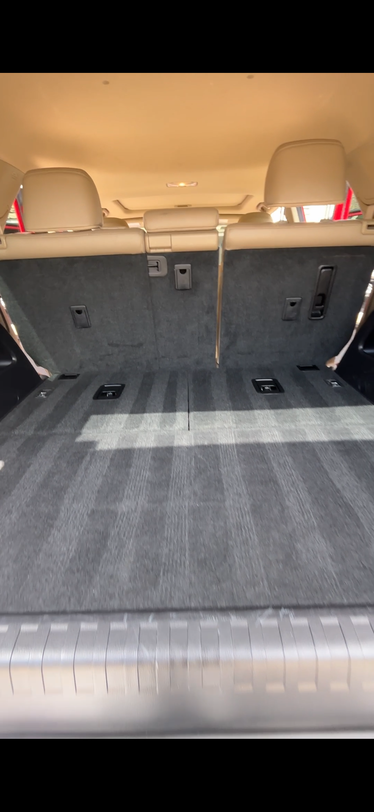 Clean vacuumed carpet in the cargo area of an SUV